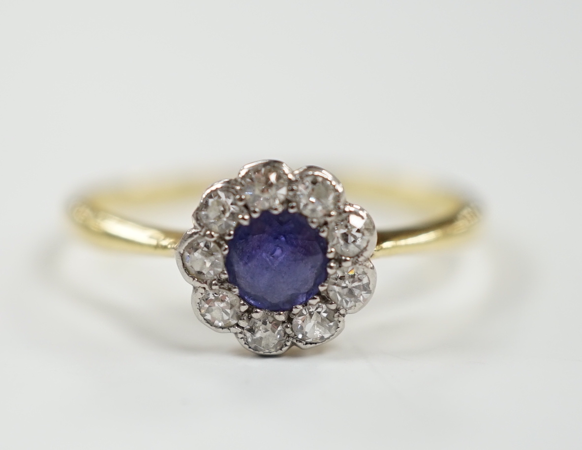 A 1920's 18ct & plat, sapphire and diamond set flower head cluster ring, size O/P, gross weight 2 grams.